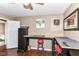 Bedroom with a wood-look floor, mounted bar table, and stool seating at 1308 N Main St, Lapel, IN 46051