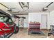 Spacious garage with red/black toolbox, chest freezer, and other tools at 1308 N Main St, Lapel, IN 46051