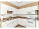 Kitchen with white cabinets, tile backsplash, and stainless steel appliances at 1308 N Main St, Lapel, IN 46051