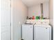 Functional laundry room equipped with modern Samsung washer and dryer units at 1308 N Main St, Lapel, IN 46051