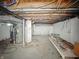 Unfinished basement with exposed ceiling beams at 145 S 7Th Ave, Beech Grove, IN 46107