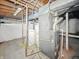 Furnace and water heater in the unfinished basement at 145 S 7Th Ave, Beech Grove, IN 46107