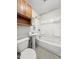 Bathroom features a tub-shower combination and a pedestal sink at 145 S 7Th Ave, Beech Grove, IN 46107