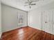 Bedroom featuring hardwood floors, ceiling fan, and natural light from a window at 145 S 7Th Ave, Beech Grove, IN 46107