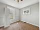 Bedroom featuring neutral walls, windows, and a ceiling fan at 145 S 7Th Ave, Beech Grove, IN 46107