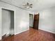 Bedroom with hardwood floors and a door to another room at 145 S 7Th Ave, Beech Grove, IN 46107