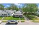 Street-level view featuring charming single-story home surrounded by mature trees and greenery at 145 S 7Th Ave, Beech Grove, IN 46107