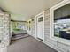 Covered porch featuring stone columns and cozy space, perfect for enjoying outdoor living at 145 S 7Th Ave, Beech Grove, IN 46107