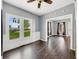 View of the living room with hardwood floors and large windows providing a lot of natural light at 145 S 7Th Ave, Beech Grove, IN 46107