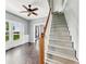 Open living room featuring hardwood floors, a ceiling fan and lots of natural light at 145 S 7Th Ave, Beech Grove, IN 46107