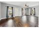 Bright living room featuring hardwood floors, lots of natural light, a ceiling fan, and neutral paint at 145 S 7Th Ave, Beech Grove, IN 46107