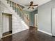 Open living room featuring a staircase, hardwood floors, and lots of natural light at 145 S 7Th Ave, Beech Grove, IN 46107
