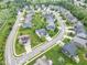 A high-angle view of a residential neighborhood highlighting landscaped yards and diverse home styles at 14931 W Black Wolf Run Dr, Carmel, IN 46033
