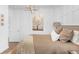 Cozy bedroom with neutral decor and a decorative chandelier at 14931 W Black Wolf Run Dr, Carmel, IN 46033