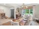 Chic dining room with seating for eight, serving buffet, elegant decor, and warm, inviting atmosphere at 14931 W Black Wolf Run Dr, Carmel, IN 46033