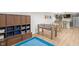 Basement game room area with a foosball table, a dining area, storage and blue accent rug at 14931 W Black Wolf Run Dr, Carmel, IN 46033