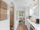 Hallway with white cabinets, countertops, and an open view of the dining room at 14931 W Black Wolf Run Dr, Carmel, IN 46033
