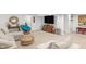 Well-lit basement living room with modern furniture, neutral carpet, and decorative touches for comfort at 14931 W Black Wolf Run Dr, Carmel, IN 46033