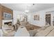 Bright living room features a fireplace, hardwood floors, and neutral furnishings at 14931 W Black Wolf Run Dr, Carmel, IN 46033