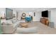 Cozy basement living room with plush sectional sofa, accent chair and decor, ideal for relaxing at 14931 W Black Wolf Run Dr, Carmel, IN 46033