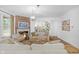 Bright living room features a fireplace, hardwood floors, and neutral furnishings at 14931 W Black Wolf Run Dr, Carmel, IN 46033