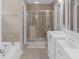 Neutral bathroom offers a soaking tub, tiled shower, and dual sink vanity at 14931 W Black Wolf Run Dr, Carmel, IN 46033