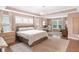Spacious main bedroom with hardwood floors, neutral walls, large windows, and a chandelier at 14931 W Black Wolf Run Dr, Carmel, IN 46033
