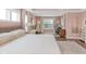 Stylish bedroom featuring hardwood floors, neutral walls, dual workstations, and large windows at 14931 W Black Wolf Run Dr, Carmel, IN 46033