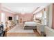 Large bedroom with hardwood floors, neutral walls, walk-in closet and stylish furnishings at 14931 W Black Wolf Run Dr, Carmel, IN 46033