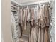 Spacious walk-in closet featuring ample hanging space and built-in shelving for optimal organization at 14931 W Black Wolf Run Dr, Carmel, IN 46033