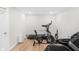 A modern workout room featuring exercise equipment and luxury massage chair, perfect for at-home fitness at 14931 W Black Wolf Run Dr, Carmel, IN 46033