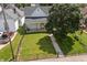 Aerial view of the home showing the yard, nearby trees, fence and landscaping at 1627 Pleasant St, Indianapolis, IN 46203