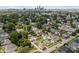 A sprawling cityscape view highlights a neighborhood with lush trees and houses at 1627 Pleasant St, Indianapolis, IN 46203