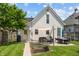 Charming backyard with a patio, modern outdoor furniture, lush lawn, and access to the home at 1627 Pleasant St, Indianapolis, IN 46203