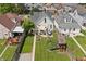 An overhead view of a backyard with a patio, play set, and neatly manicured lawn at 1627 Pleasant St, Indianapolis, IN 46203