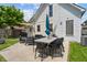 Spacious backyard with outdoor seating, a grill, and a shade umbrella for entertaining at 1627 Pleasant St, Indianapolis, IN 46203