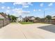 Expansive concrete backyard with a playground and ample space for recreation and outdoor activities at 1627 Pleasant St, Indianapolis, IN 46203