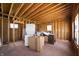 Unfinished basement with a washer/dryer, utilities, and framed walls at 1627 Pleasant St, Indianapolis, IN 46203