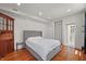 Comfortable bedroom with hardwood floors, white walls, and classic details at 1627 Pleasant St, Indianapolis, IN 46203