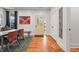 Charming entryway with a yellow front door, hardwood floors, and modern decor at 1627 Pleasant St, Indianapolis, IN 46203