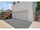 Large detached two-story garage with a private entrance and an extended concrete driveway at 1627 Pleasant St, Indianapolis, IN 46203