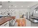 Modern kitchen featuring wood countertops, stainless steel appliances, white cabinets and hardware floors at 1627 Pleasant St, Indianapolis, IN 46203