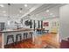 Bright open kitchen with stainless steel appliances, hardwood floors and large island at 1627 Pleasant St, Indianapolis, IN 46203