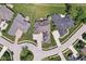 Aerial view of a meticulously landscaped home featuring an expansive lawn and inviting outdoor patio, surrounded by verdant greenery at 16332 Valhalla Dr, Noblesville, IN 46060