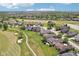 Scenic aerial view of a golf course community showcasing lush greens, mature trees, and well-maintained homes, an inviting neighborhood at 16332 Valhalla Dr, Noblesville, IN 46060