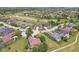 Picturesque aerial view of a golf course community with tree-lined streets and manicured lawns, showcasing an idyllic neighborhood at 16332 Valhalla Dr, Noblesville, IN 46060