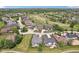 Scenic aerial view of a golf course community featuring well-maintained homes, lush green fairways, and tranquil ponds at 16332 Valhalla Dr, Noblesville, IN 46060