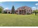 Beautiful backyard with a well manicured lawn and a home featuring brick accents at 16332 Valhalla Dr, Noblesville, IN 46060