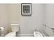 Neutral-toned half bathroom featuring a bidet, toilet, and towel rack at 16332 Valhalla Dr, Noblesville, IN 46060