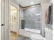 Bright bathroom features a tiled walk-in shower, modern vanity, and neutral color scheme at 16332 Valhalla Dr, Noblesville, IN 46060